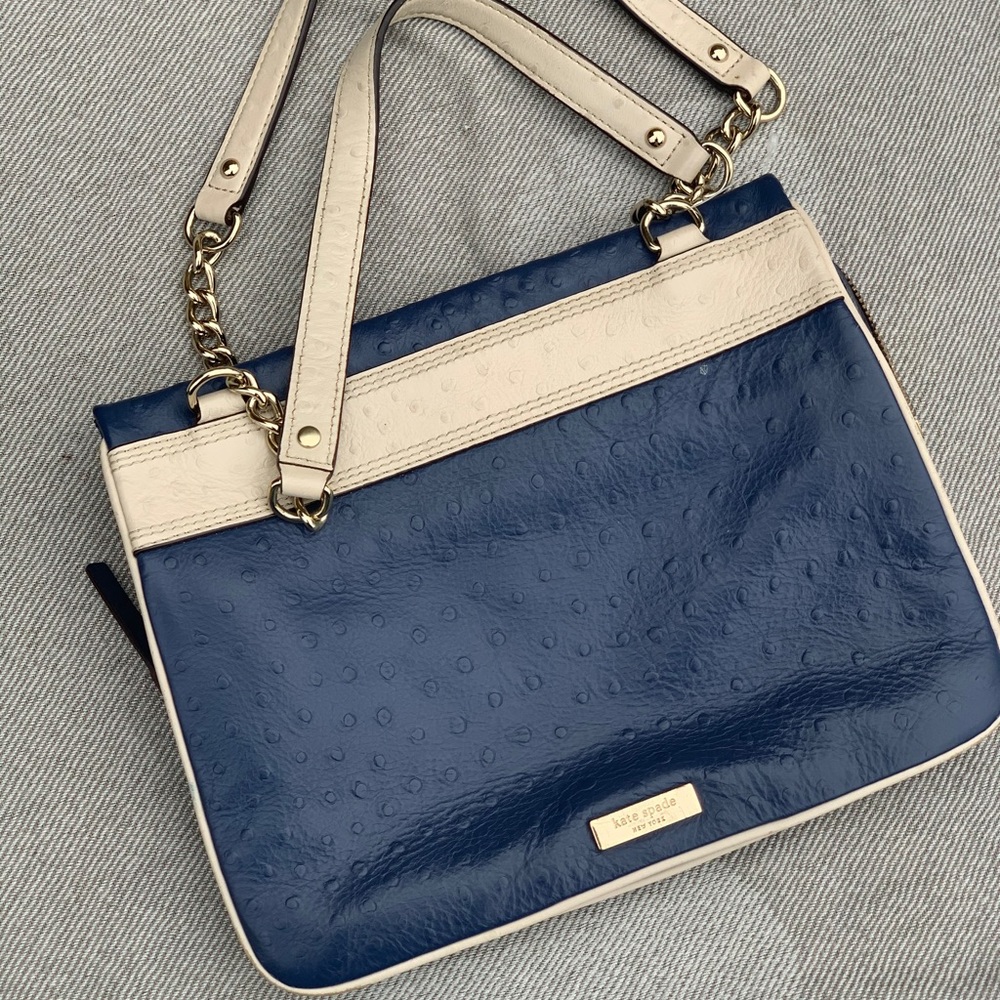 Navy blue and beige Kate Spade handbag.